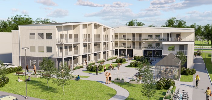 Fågelvy över planerat bostadsområde med låg bebyggelse och innergård.