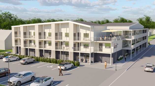 Fågelvy över planerat bostadsområde med låg bebyggelse och innergård.